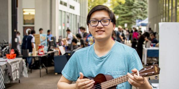 Student playing ukulele