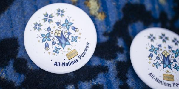 Two buttons that say All Nations Powwow