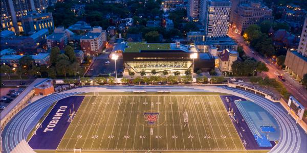 Varsity Stadium football field at night
