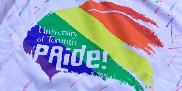 A rainbow graphic painted on a t-shirt that says University of Toronto Pride!