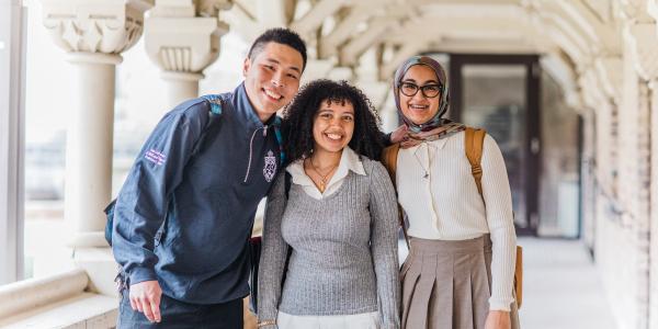 Smiling students in breezeway.