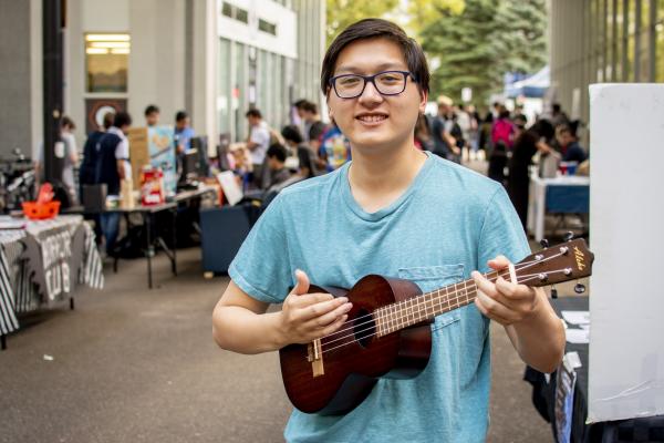 Student playing ukulele