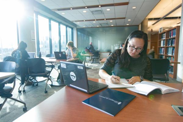 Student studying in UTM library.