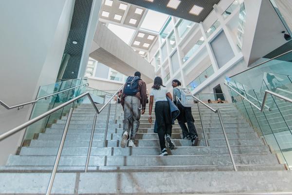 Students walking up stairs.