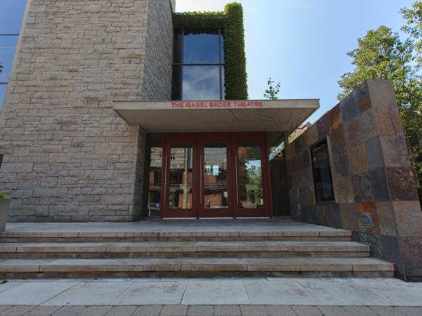 Front entrance of the Isabel Bader Theatre; stone steps leading to glass doors