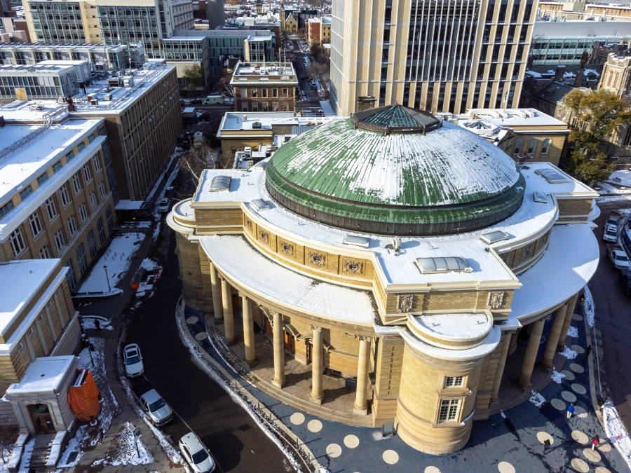 Aerial view of Convocation Hall with a snow-dusted green dome