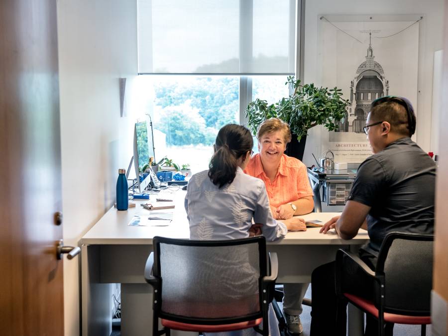 Staff sitting in a guidance office.