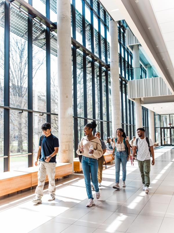 Students walking through hallway.